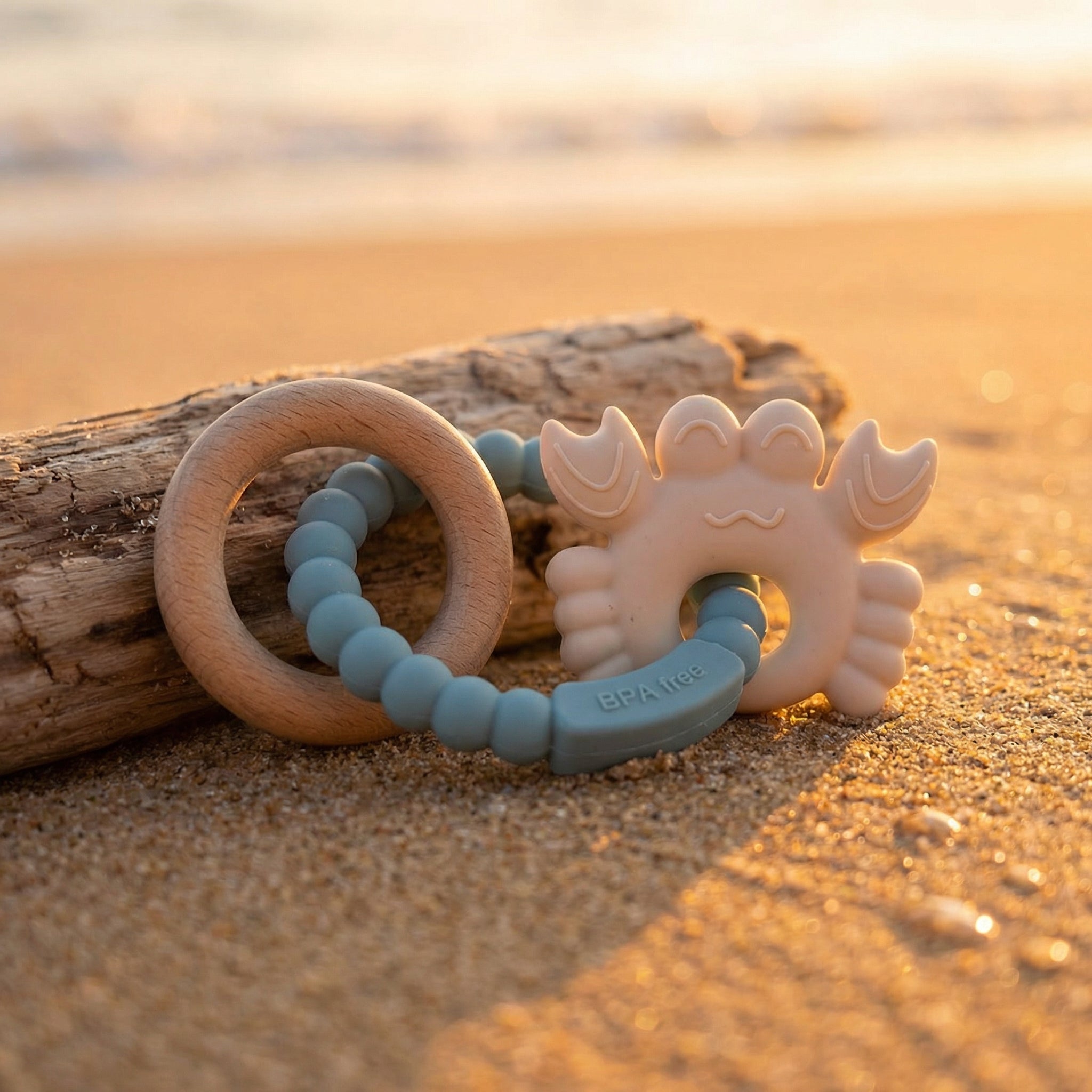 Textured baby teether flat lay with wood ring detail