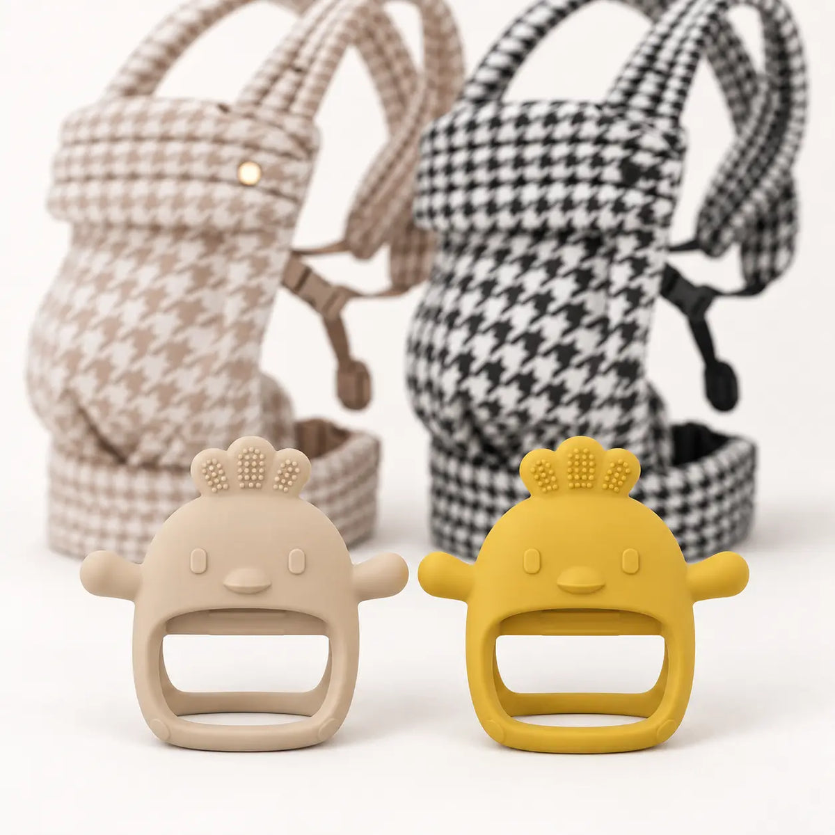 Carry and Soothe gift bundle, close-up of Nest silicone teethers with Birch and Onyx carriers
