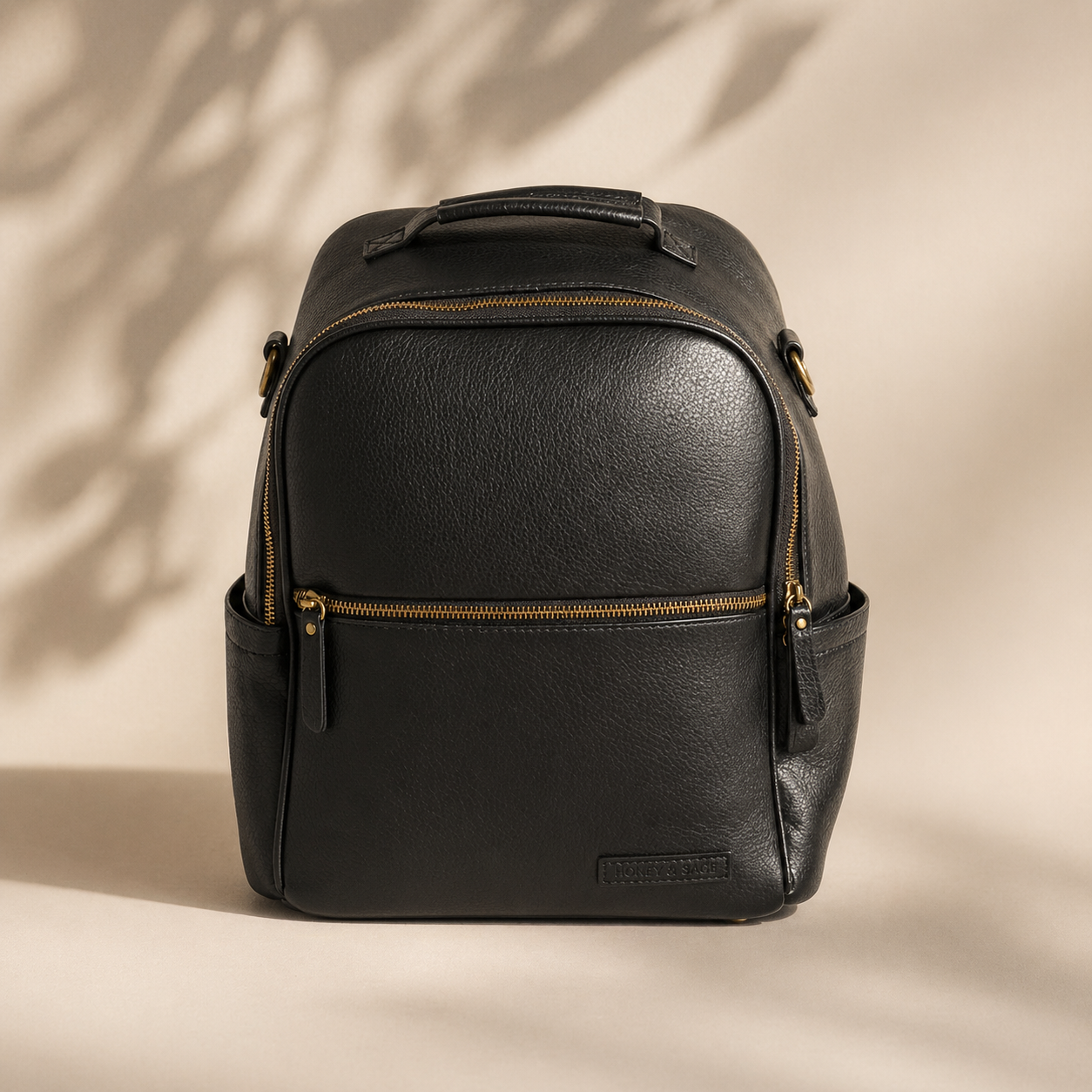 Black nappy bag backpack — The Flint by Honey & Sage with interchangeable strap system in dark neutral tone