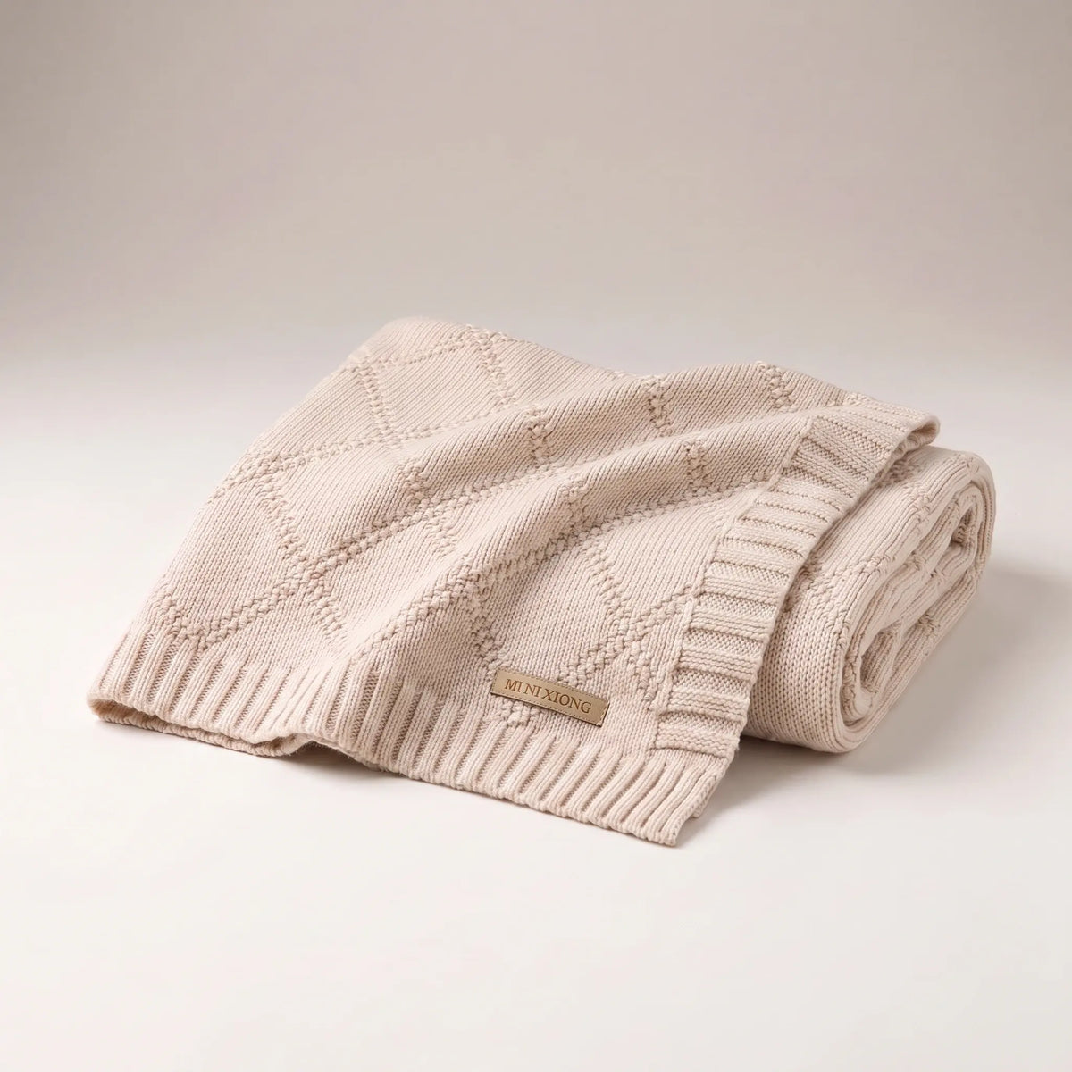 Lightweight cotton diamond knit baby blanket in Banjo