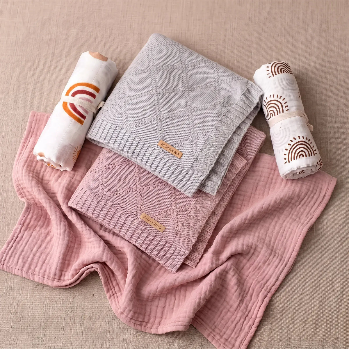 Deluxe knit blanket and swaddle bundle with diamond knit baby blankets and rolled muslin swaddles