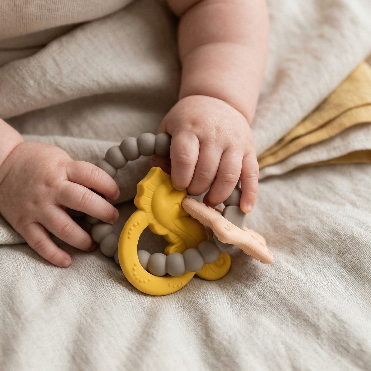 Golden Sand silicone and beechwood baby teether, close-up detail - Honey & Sage