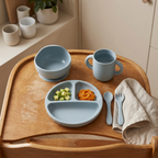 Children's dinig set including bowl, mug, plate, cutlery, and napkin on a wooden tray in Harbour blue