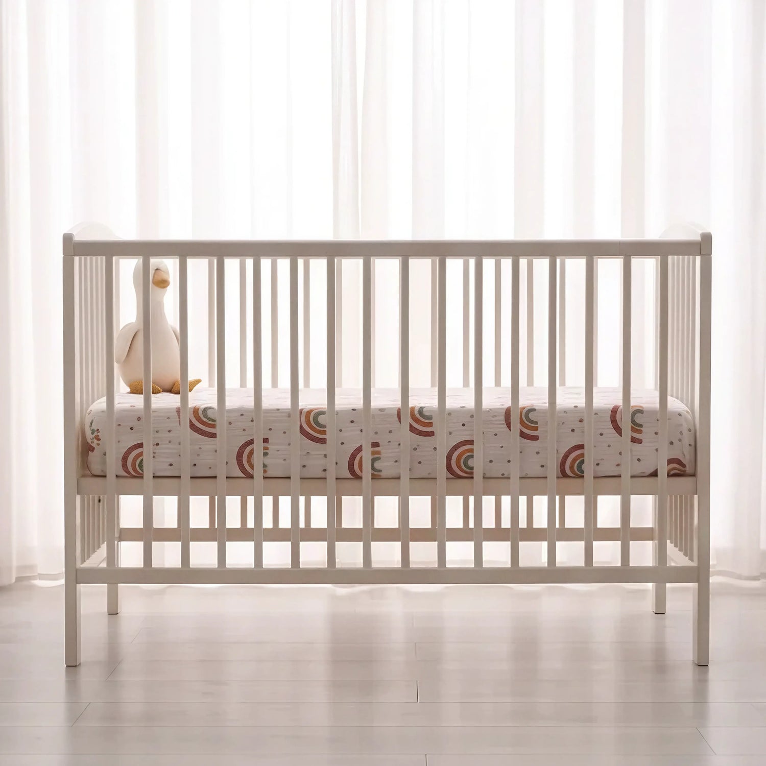 Sunbeam fitted baby cot sheet, wide shot on white cot mattress - Honey & Sage