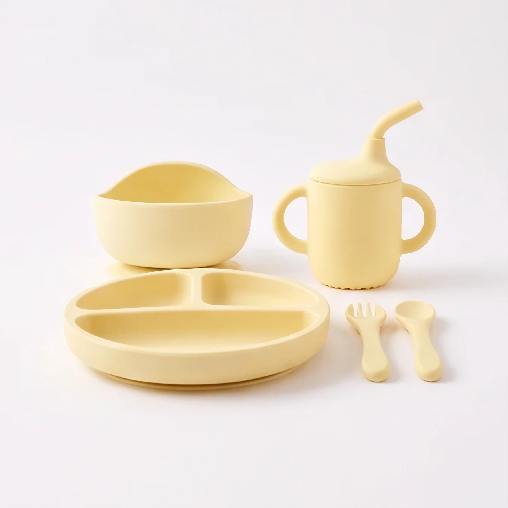 5 piece baby silicone feeing set in Dawn (bright yellow) with suction plate, sippy cup, suction bowl, fork and spoon