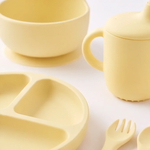 5 piece baby silicone feeing set in Dawn (bright yellow) with suction plate, sippy cup, suction bowl, fork and spoon