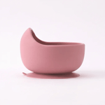 Silicone suction bowl in Rosewood (blush pink), angled view