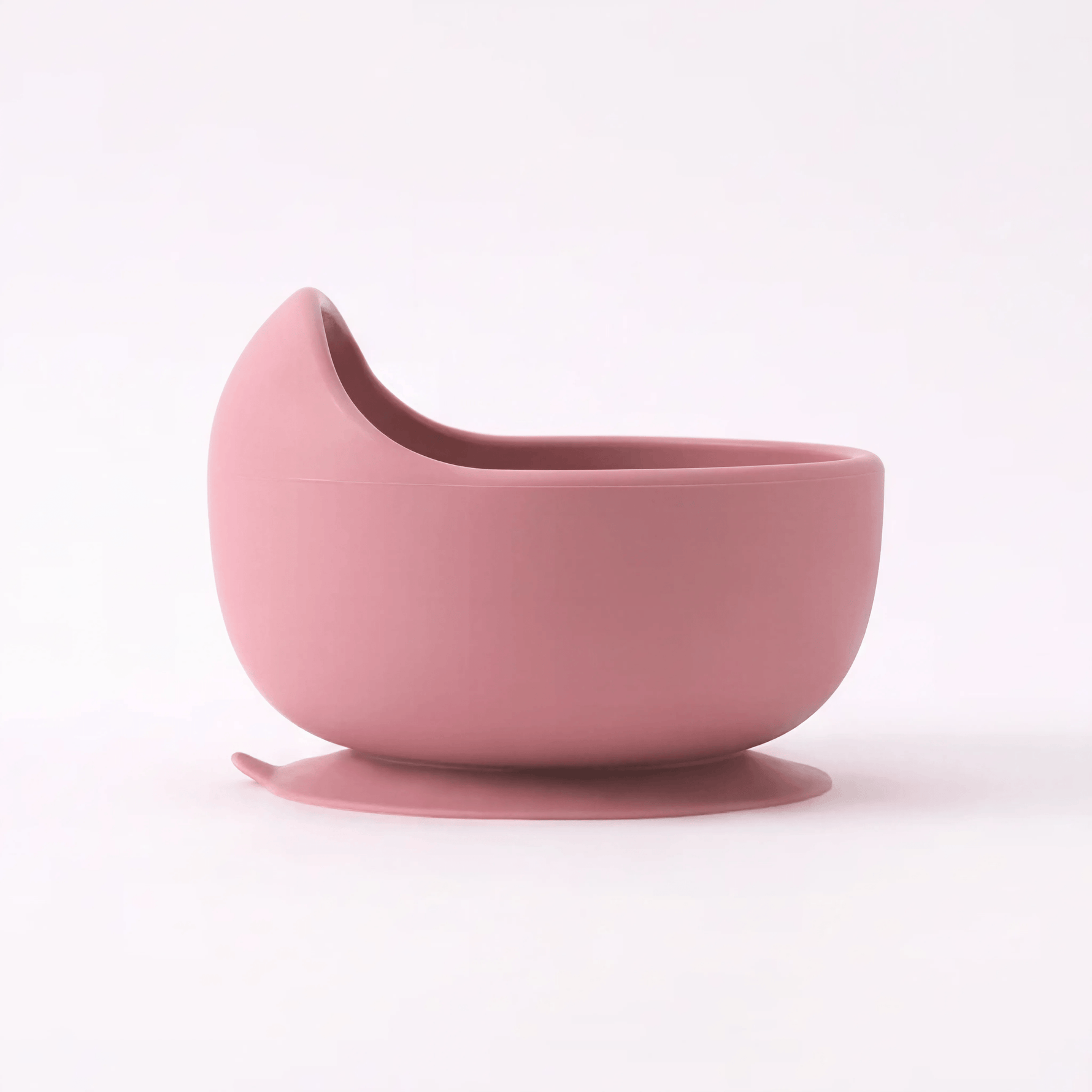 Silicone suction bowl in Rosewood (blush pink), angled view