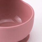 Silicone suction bowl in Rosewood (blush pink), close-up showing suction base