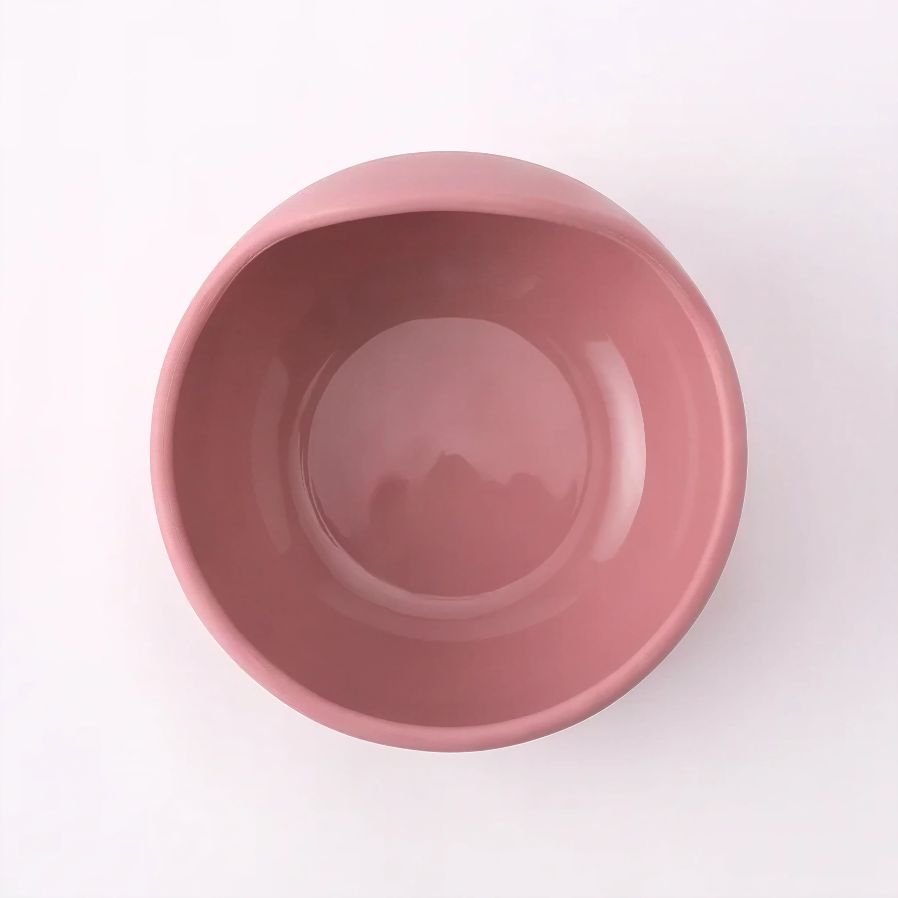 Silicone suction bowl in Rosewood (blush pink), close-up front view