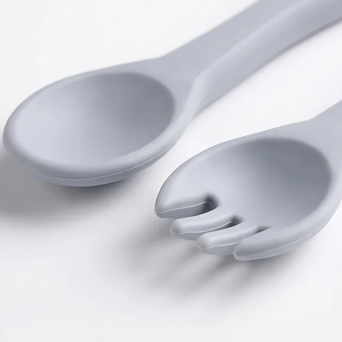 Close-up of silicone baby spoon and fork, easy-grip design