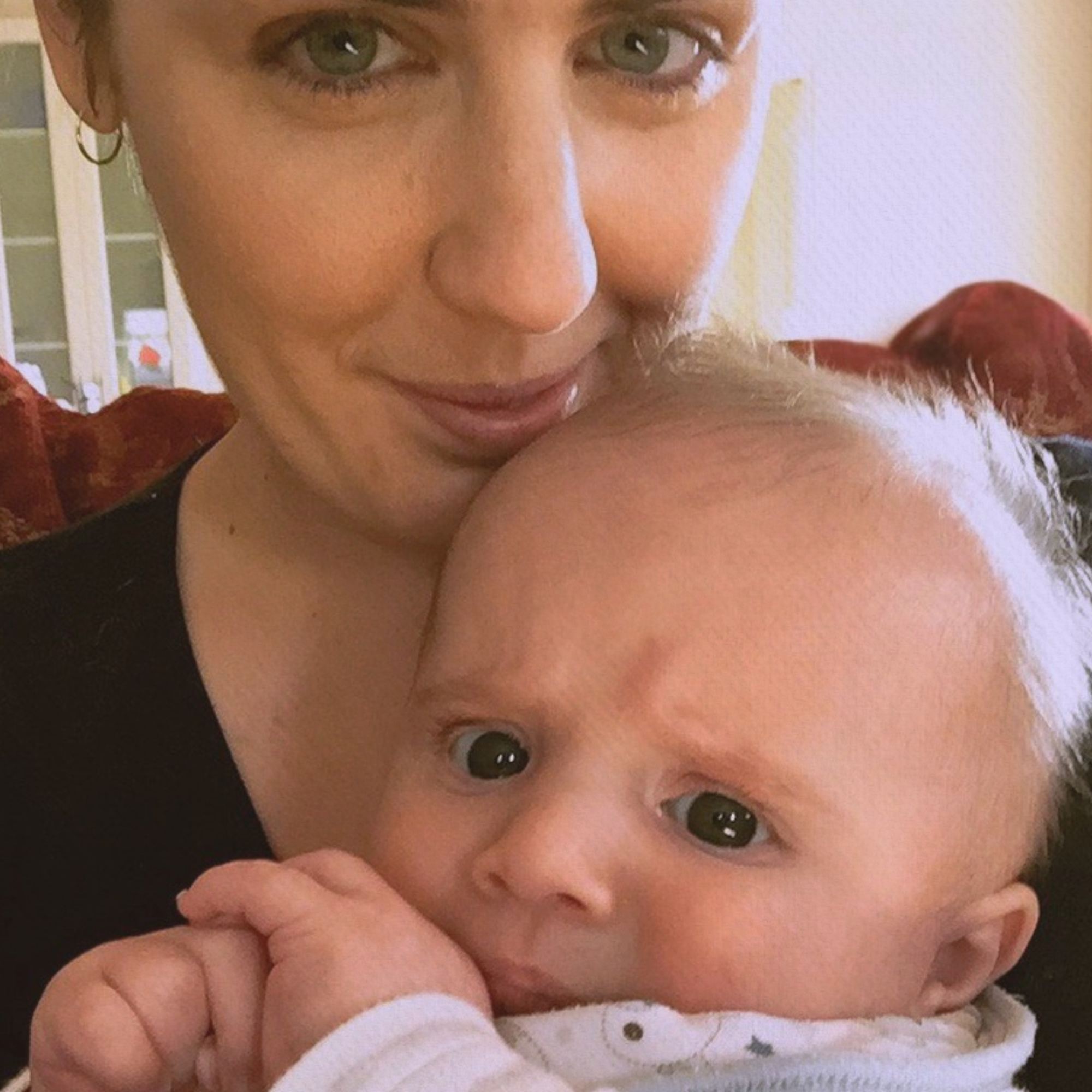 Woman holding a baby close to her face