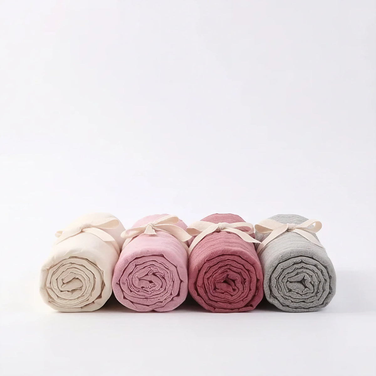 Rolled bamboo baby swaddles in Esperance, Airlie, Broome and Stirling, lined up