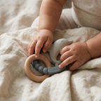 Muted blue silicone baby teether with beechwood ring
