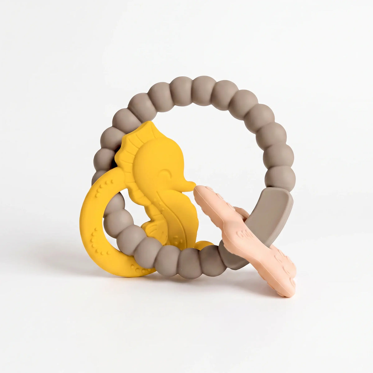 Reef silicone and beechwood baby teether in Golden Sand