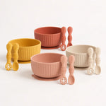 Ribbed silicone suction bowl and utensils sets in Mustard Yellow, Muted Clay, Raw Sienna and Shifting Sand
