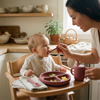 Woman feeding a child in a high chair with rosewood dining set.