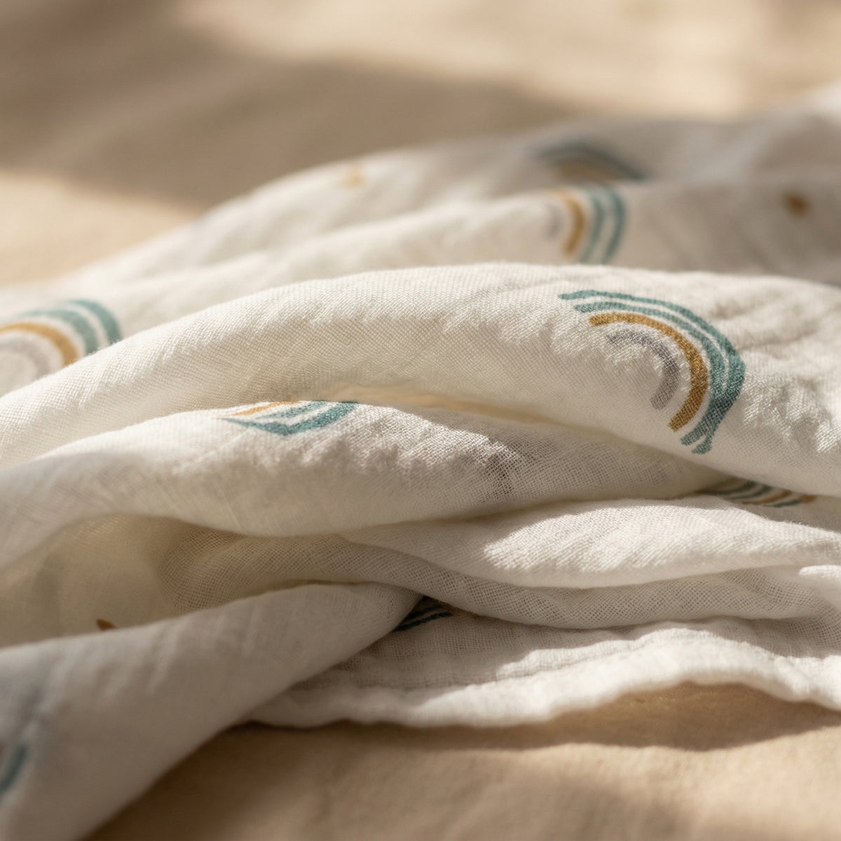 Light neutral baby swaddle soft fabric folds minimal aesthetic