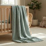 Soft blue baby swaddle blanket folded fabric texture detail