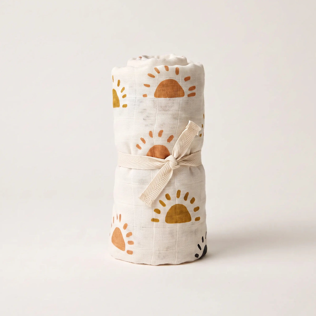Drift muslin baby swaddle in Soleil minimalist sun print