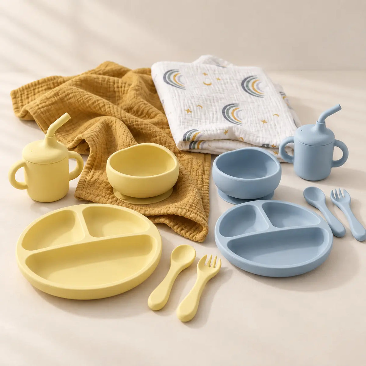 Swaddle and solids baby gift bundle with silicone feeding sets in Dawn and Harbour and a muslin swaddle