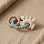 Blue and neutral silicone baby teether with beechwood ring tidal cove tones