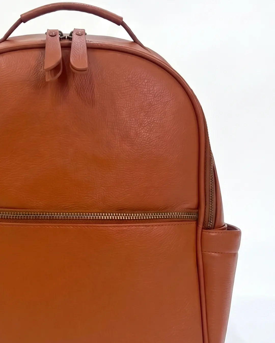 Tan nappy bag backpack - The Alder, mid close-up on white background - Honey & Sage