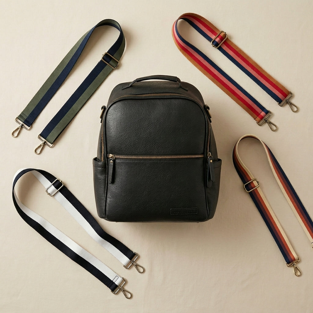 Black backpack with multiple straps on a beige background